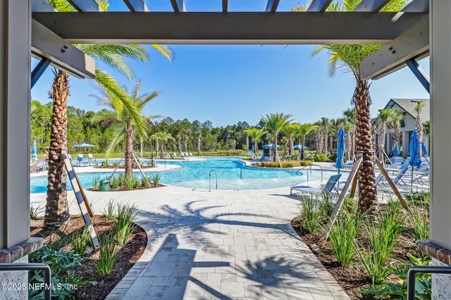 a view of a swimming pool with a patio