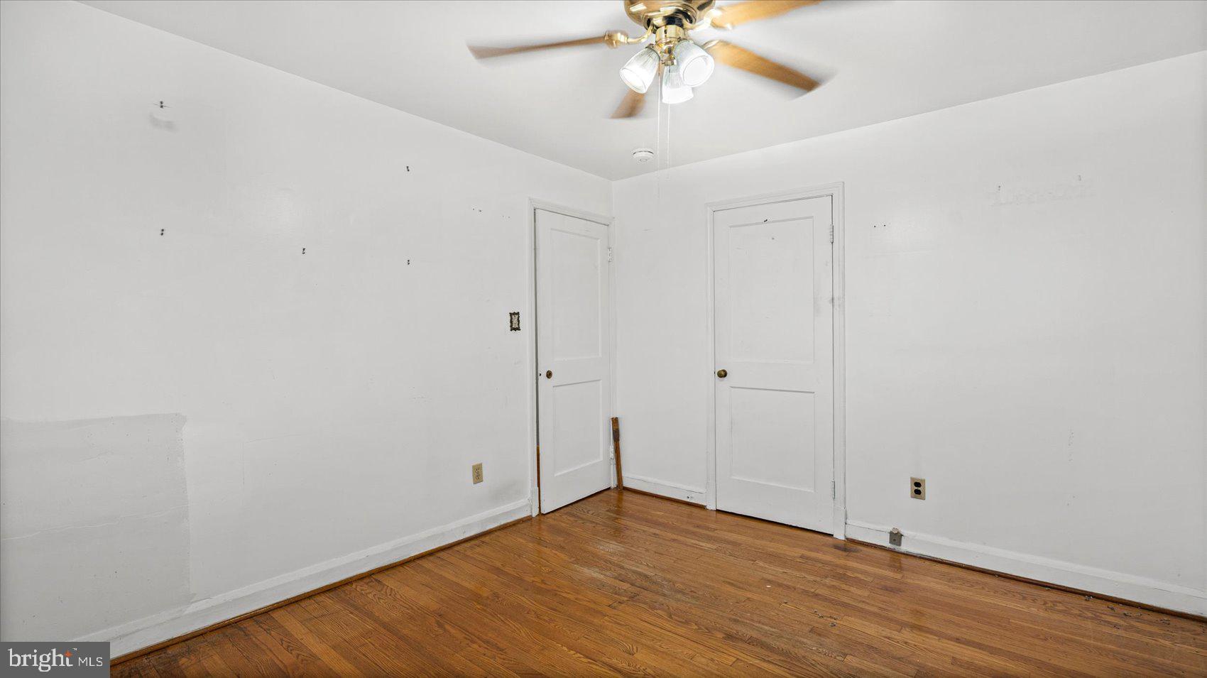 1805 Crestview Road Baltimore, MD 21239 - Photo 20 of 39 a view of an empty room with wooden floor
