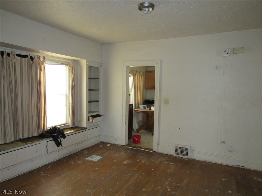 863 Eddy Road Cleveland, OH 44108 - Photo 15 of 28 Wood-finish flooring with a window seat, built-in shelving, and a flush mount ceiling light. Unit 2