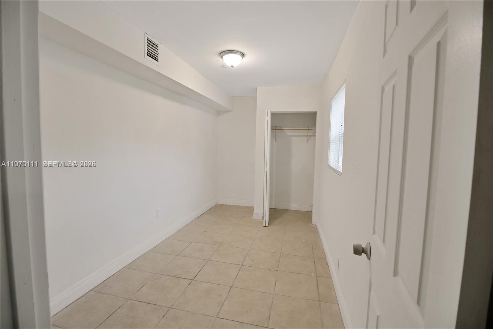1160 West 26th Court Riviera Beach, FL 33404 - Photo 13 of 40 a view of an empty room