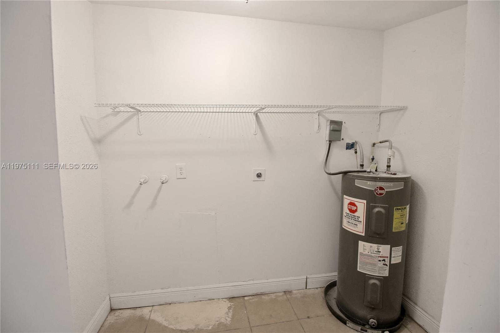 1160 West 26th Court Riviera Beach, FL 33404 - Photo 20 of 40 a view of a room with rack on the wall