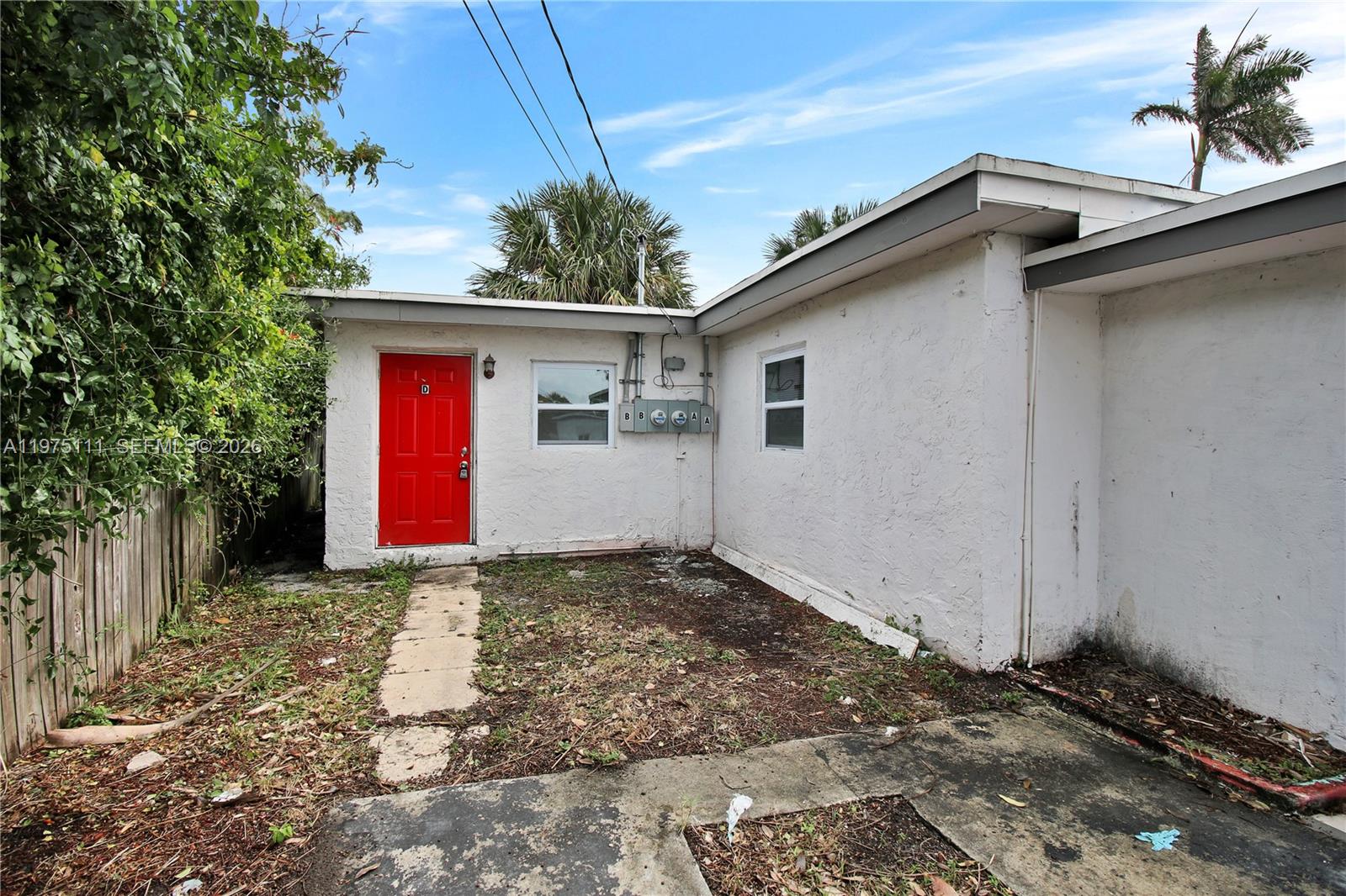 1160 West 26th Court Riviera Beach, FL 33404 - Photo 2 of 40 a view of a house with a yard