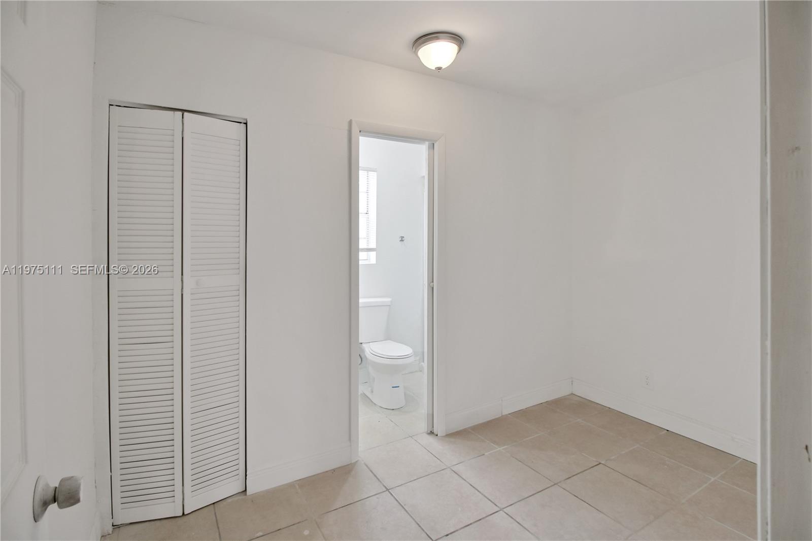1160 West 26th Court Riviera Beach, FL 33404 - Photo 22 of 39 a view of an empty room