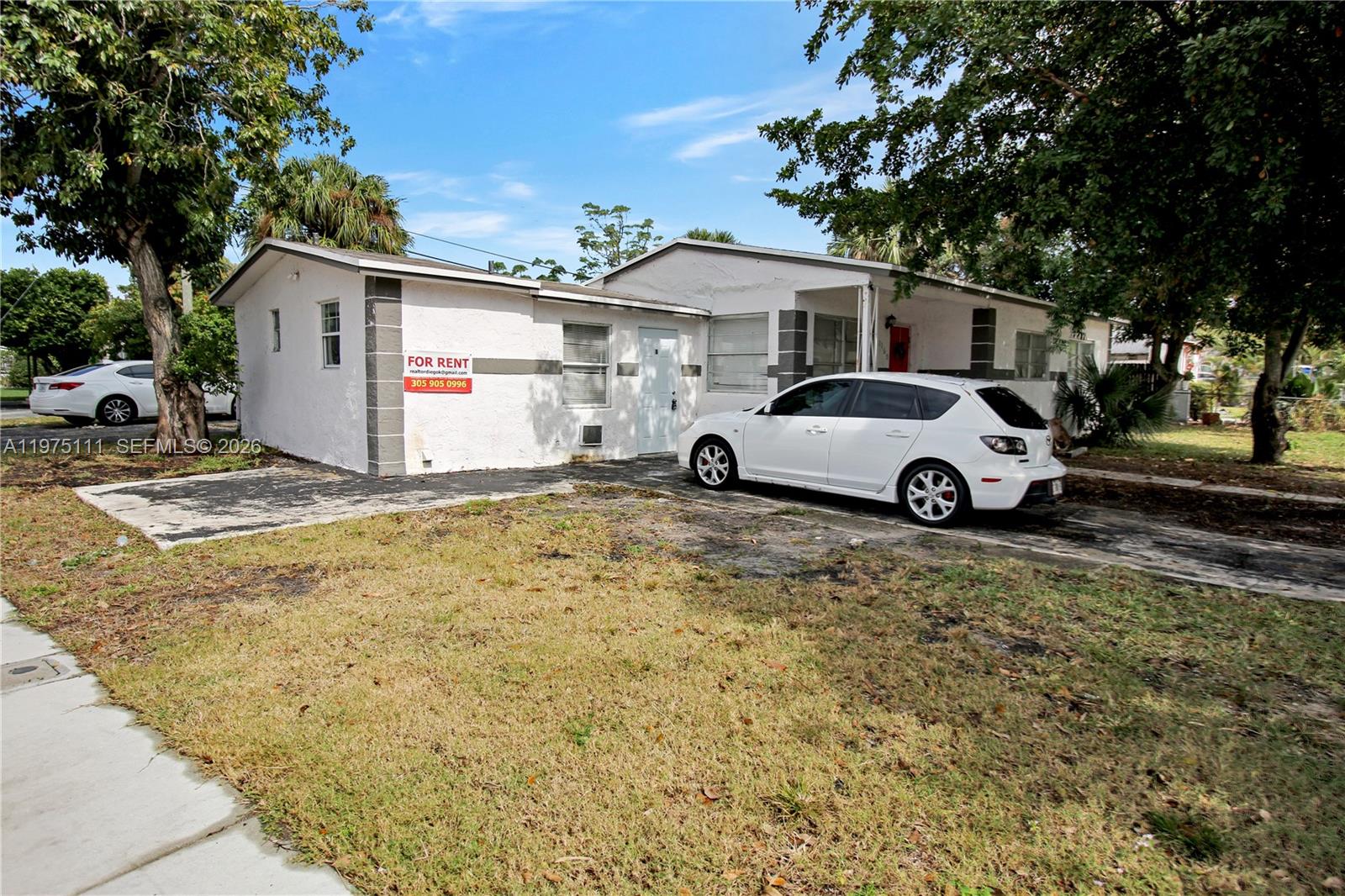1160 West 26th Court Riviera Beach, FL 33404 - Photo 36 of 40 a car parked in front of a house