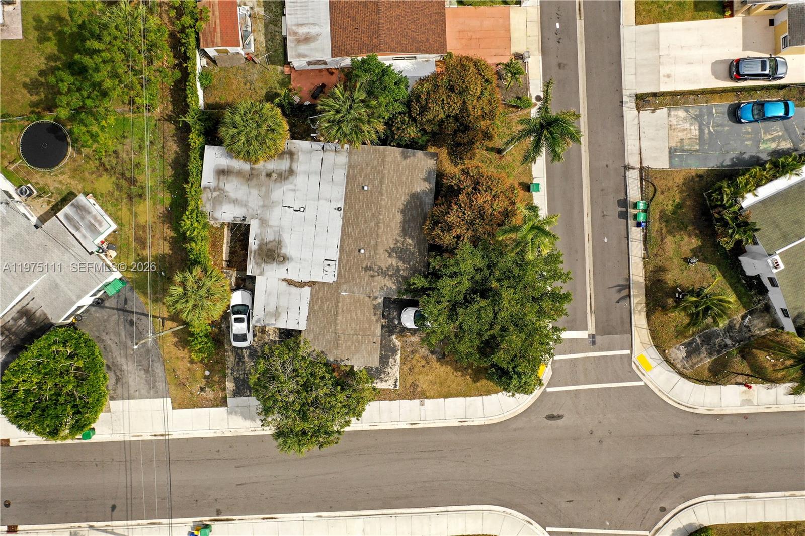 1160 West 26th Court Riviera Beach, FL 33404 - Photo 38 of 40 a view of a street with potted plants