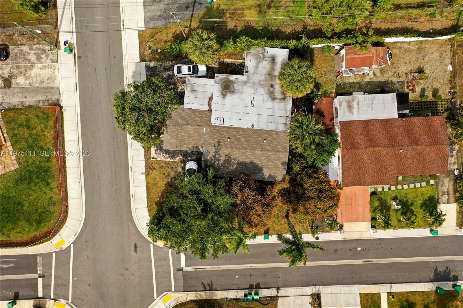 1160 West 26th Court Riviera Beach, FL 33404 - Photo 39 of 40 an aerial view of a house with a yard and large tree