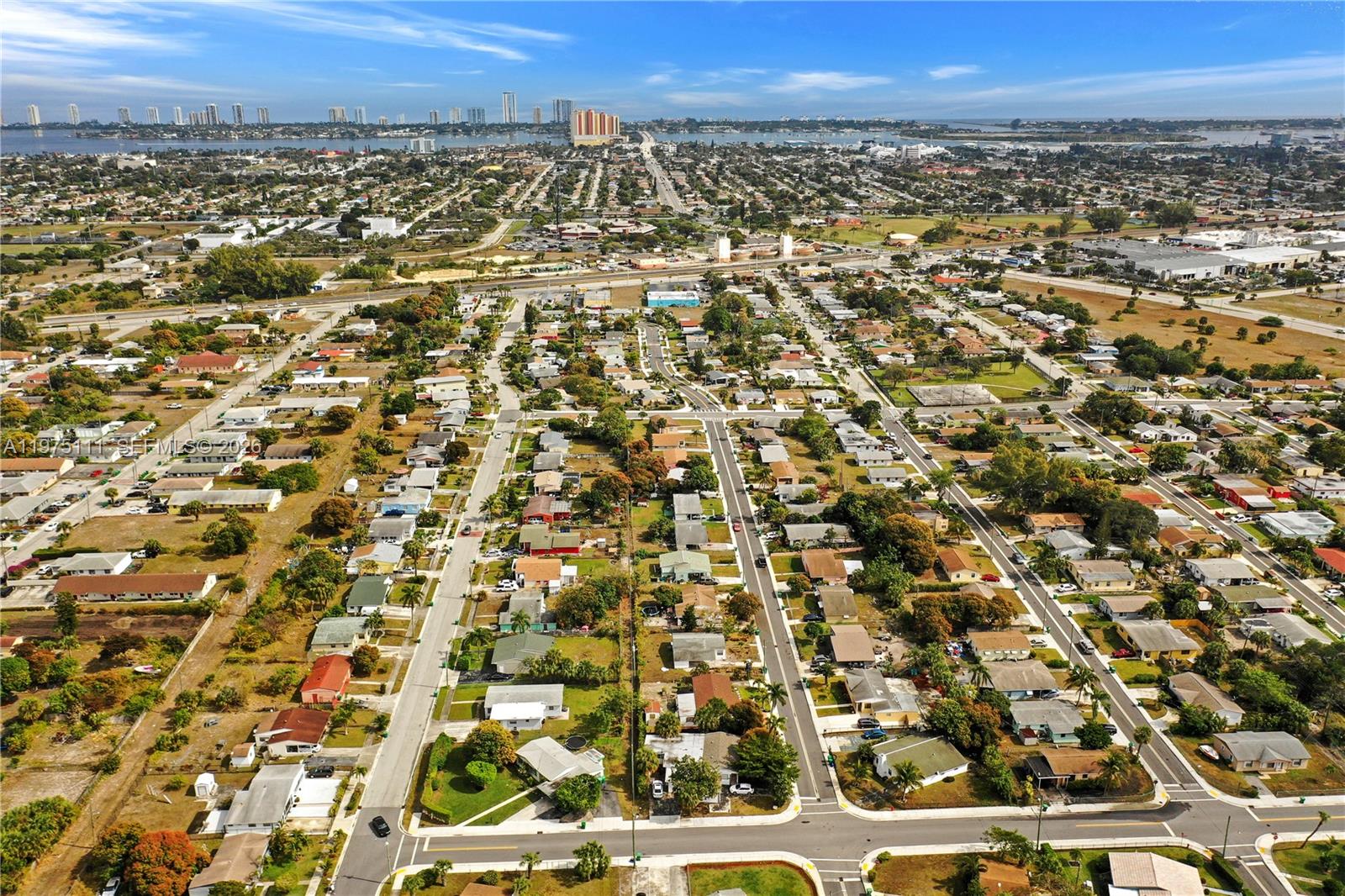 1160 West 26th Court Riviera Beach, FL 33404 - Photo 40 of 40 an aerial view of residential building and trees