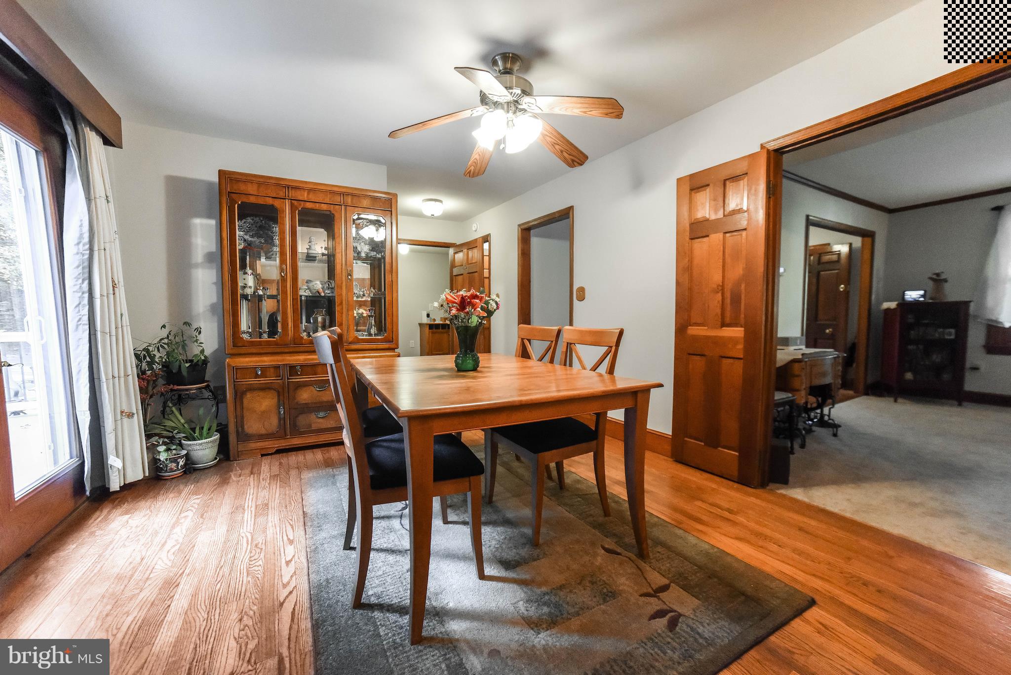 8445 Waverly Road Owings, MD 20736 - Photo 11 of 36 a view of a dining room with furniture and wooden floor