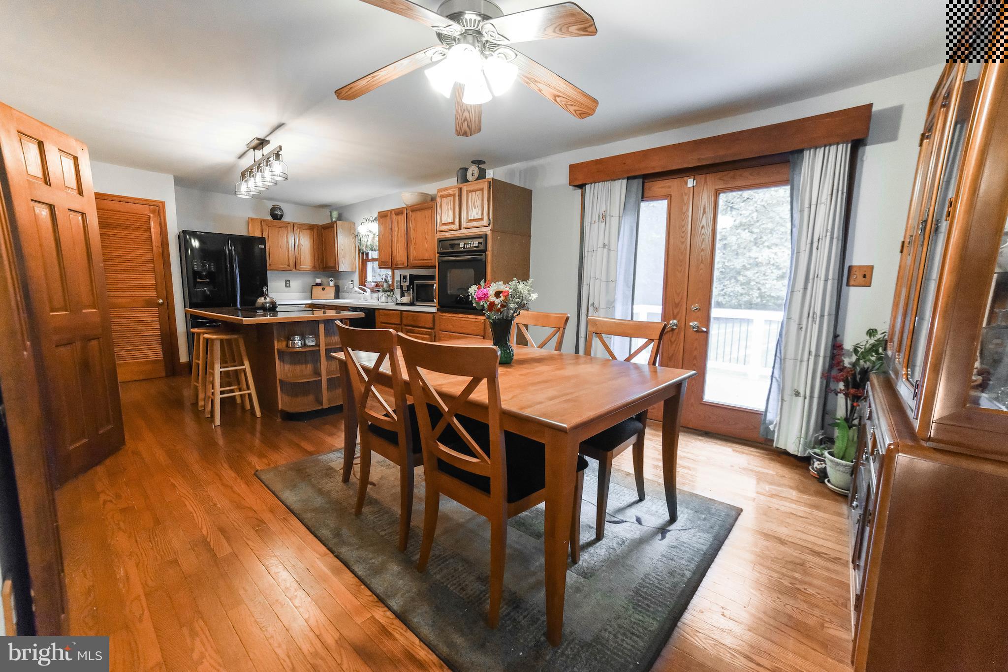 8445 Waverly Road Owings, MD 20736 - Photo 12 of 36 a view of a dining room with furniture window and wooden floor
