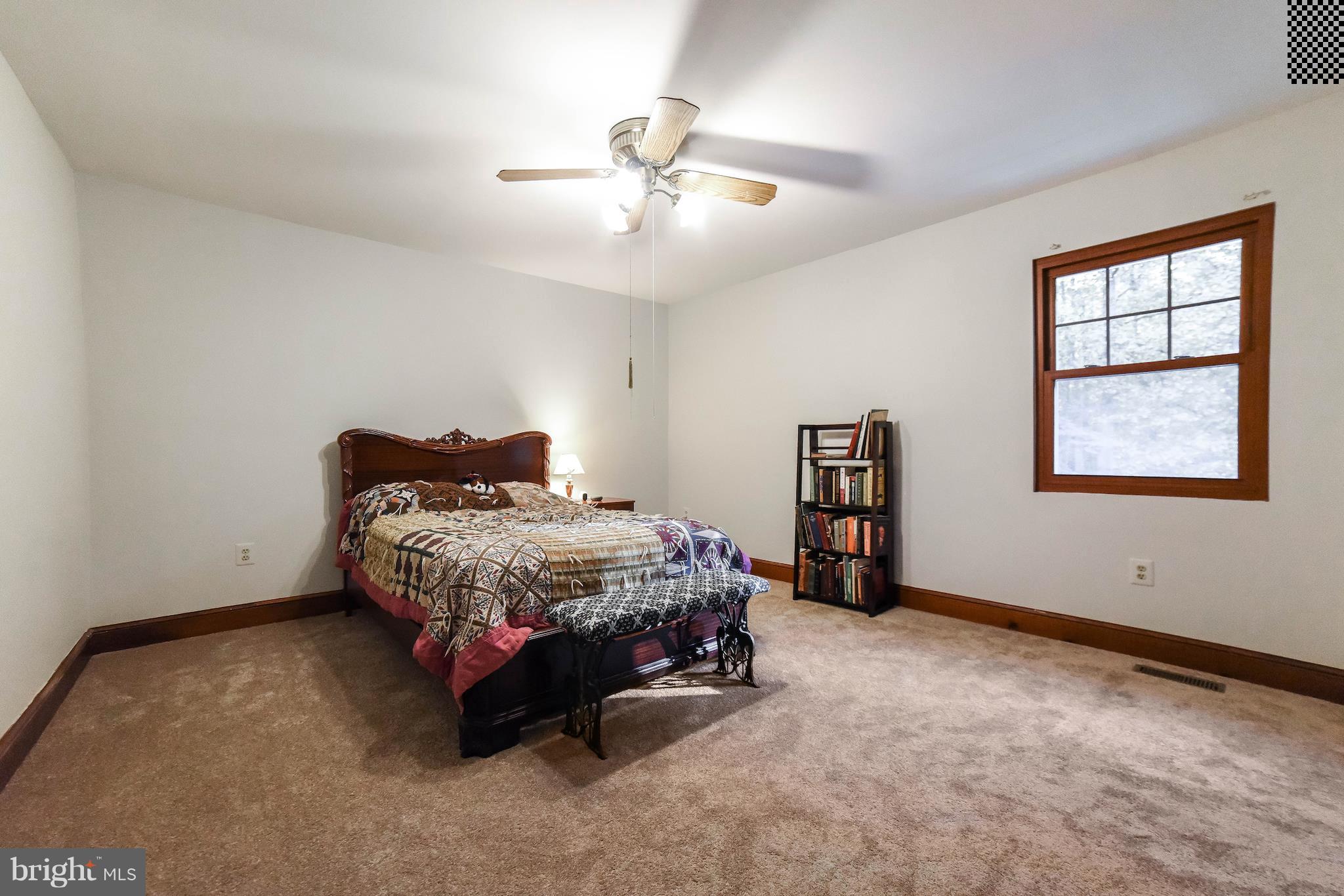 8445 Waverly Road Owings, MD 20736 - Photo 19 of 36 a bedroom with a bed and window