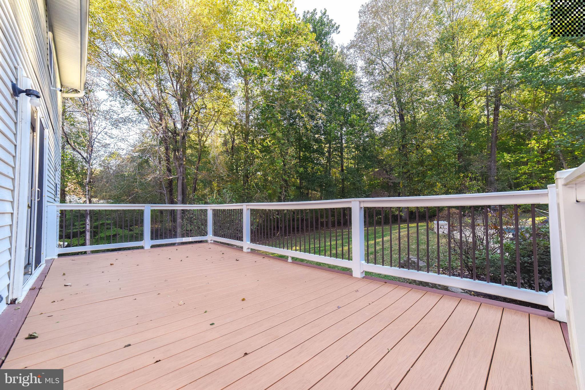8445 Waverly Road Owings, MD 20736 - Photo 34 of 36 a view of roof deck with wooden floor and fence