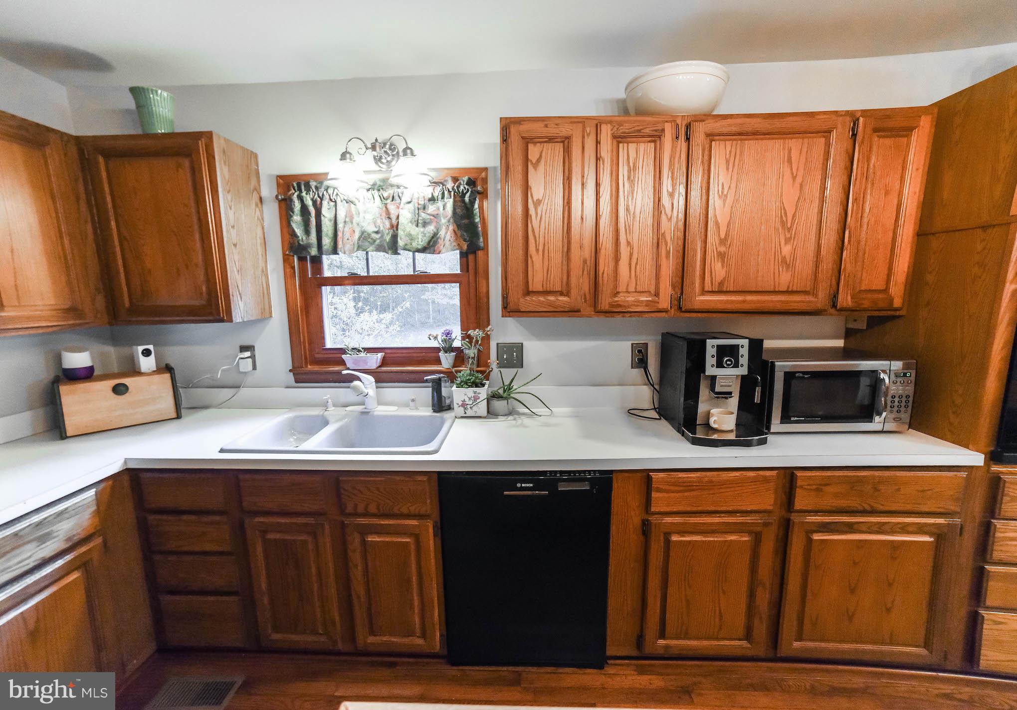 8445 Waverly Road Owings, MD 20736 - Photo 8 of 36 a kitchen with stainless steel appliances granite countertop wooden cabinets a sink and dishwasher
