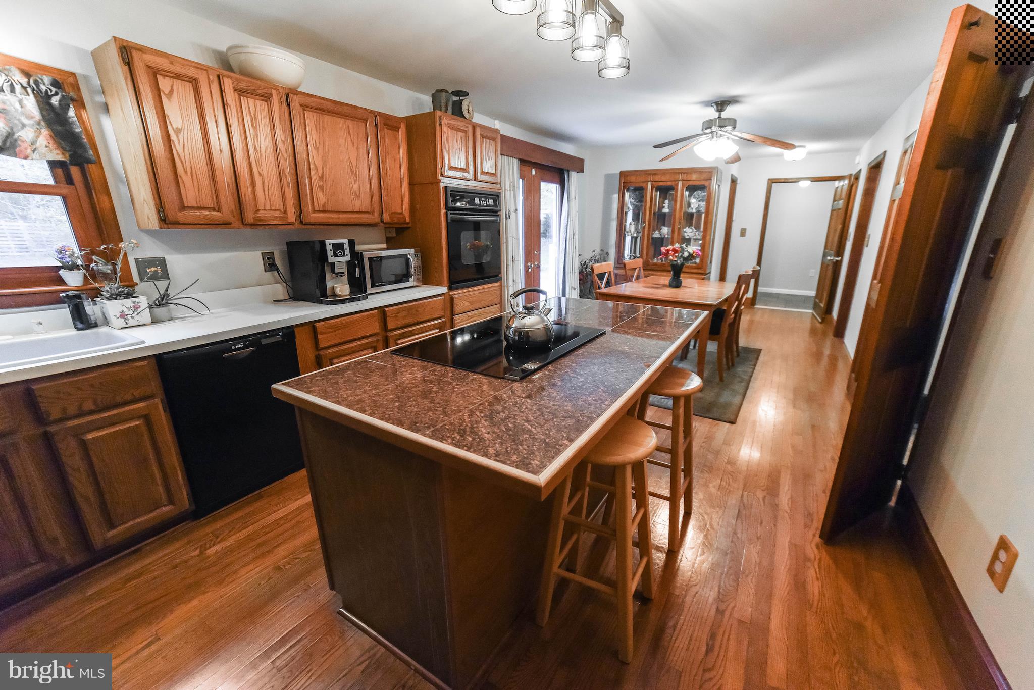 8445 Waverly Road Owings, MD 20736 - Photo 9 of 36 a kitchen with stainless steel appliances granite countertop a sink stove and refrigerator