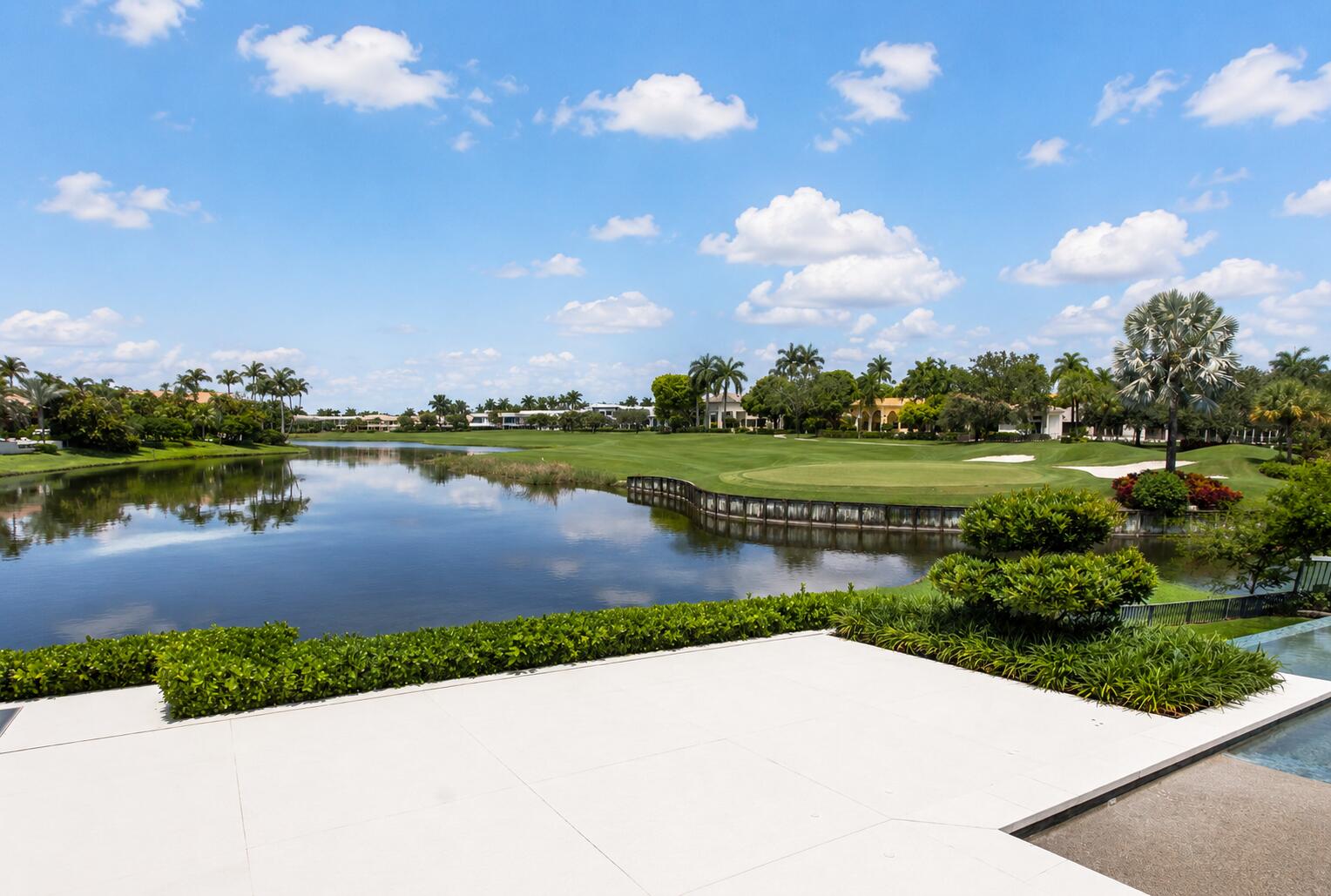 6960 Lake Estates Court Boca Raton, FL 33496 - Photo 43 of 58 a view of a lake with houses in the back