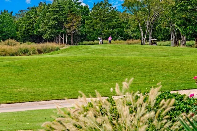 a view of a swimming pool with a table and chairs
