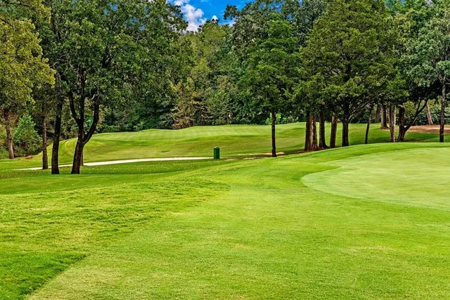 a living room with lots of furniture and a large window