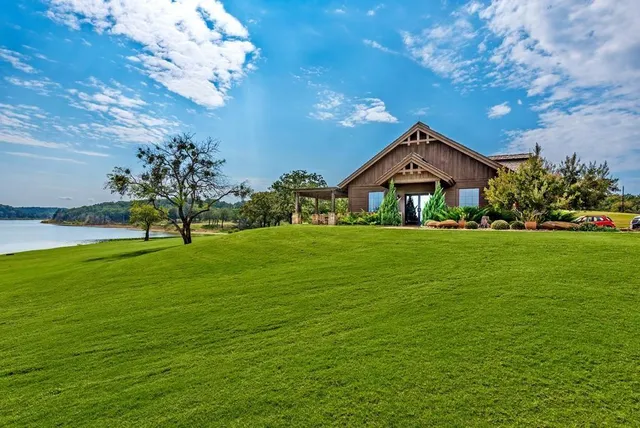 a view of a lake in front of the house