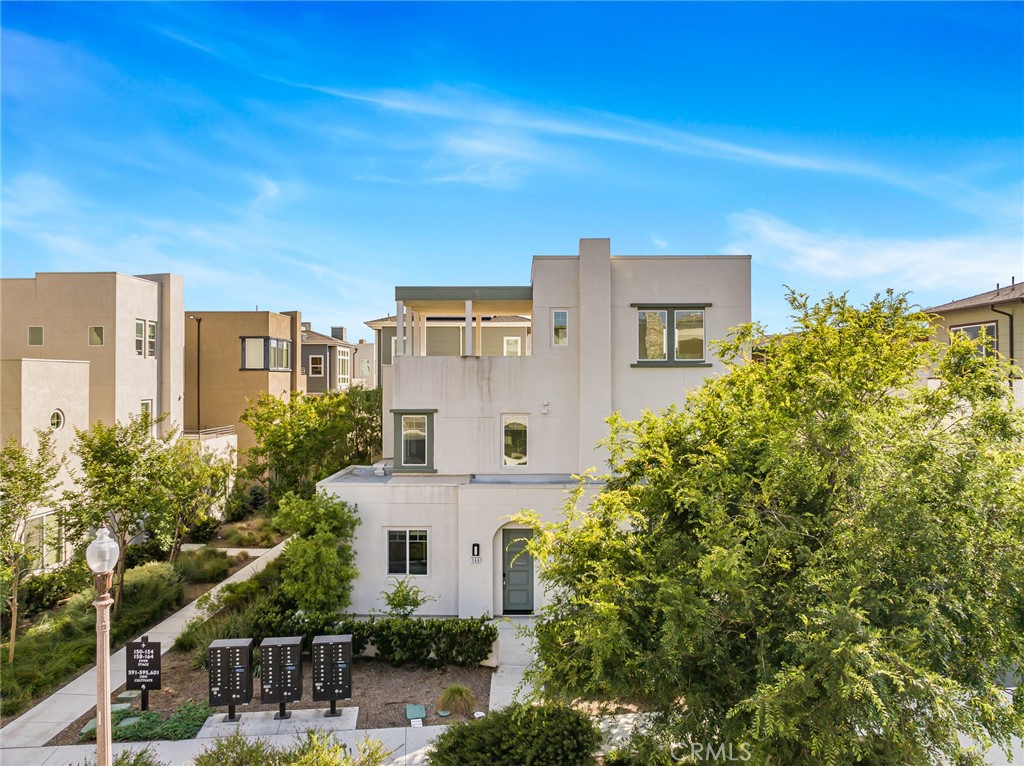 148 Stage Irvine, CA 92618 - Photo 1 of 1 a front view of a house with plants and trees