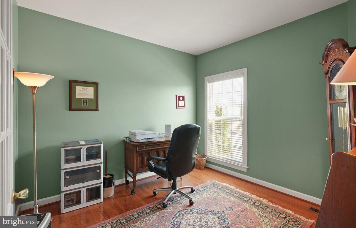 9199 Furey Road Lorton, VA 22079 - Photo 11 of 44 a view of a workspace with furniture and a window