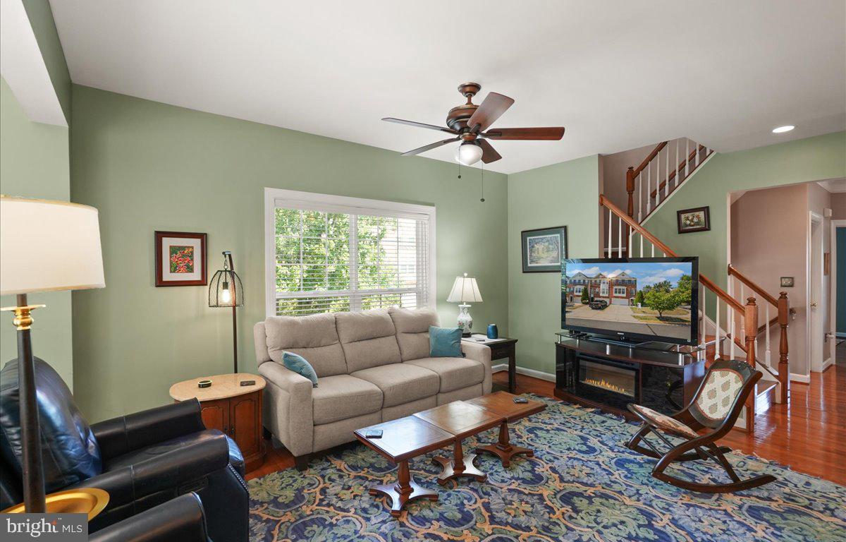 9199 Furey Road Lorton, VA 22079 - Photo 14 of 44 a living room with furniture a window and a flat screen tv