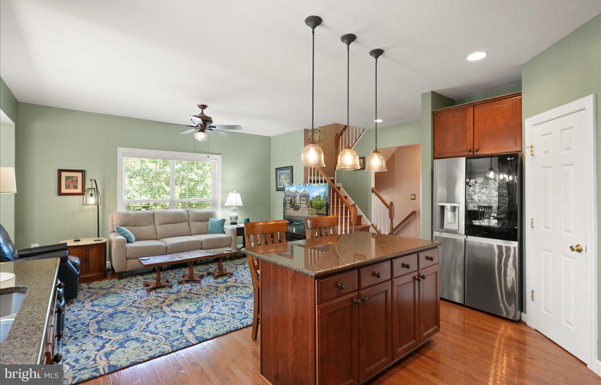 9199 Furey Road Lorton, VA 22079 - Photo 17 of 44 a living room with stainless steel appliances granite countertop furniture and a wooden floor