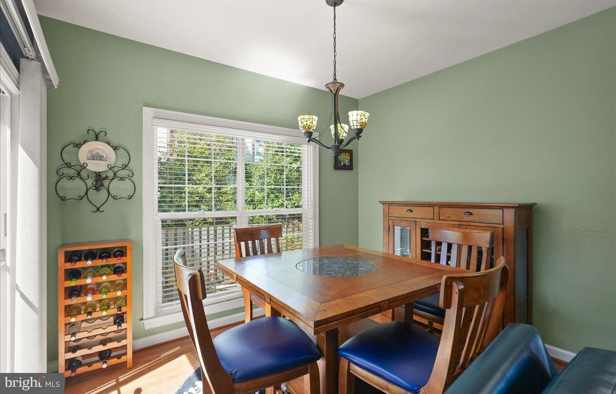 9199 Furey Road Lorton, VA 22079 - Photo 19 of 44 a view of a dining room with furniture window and wooden floor