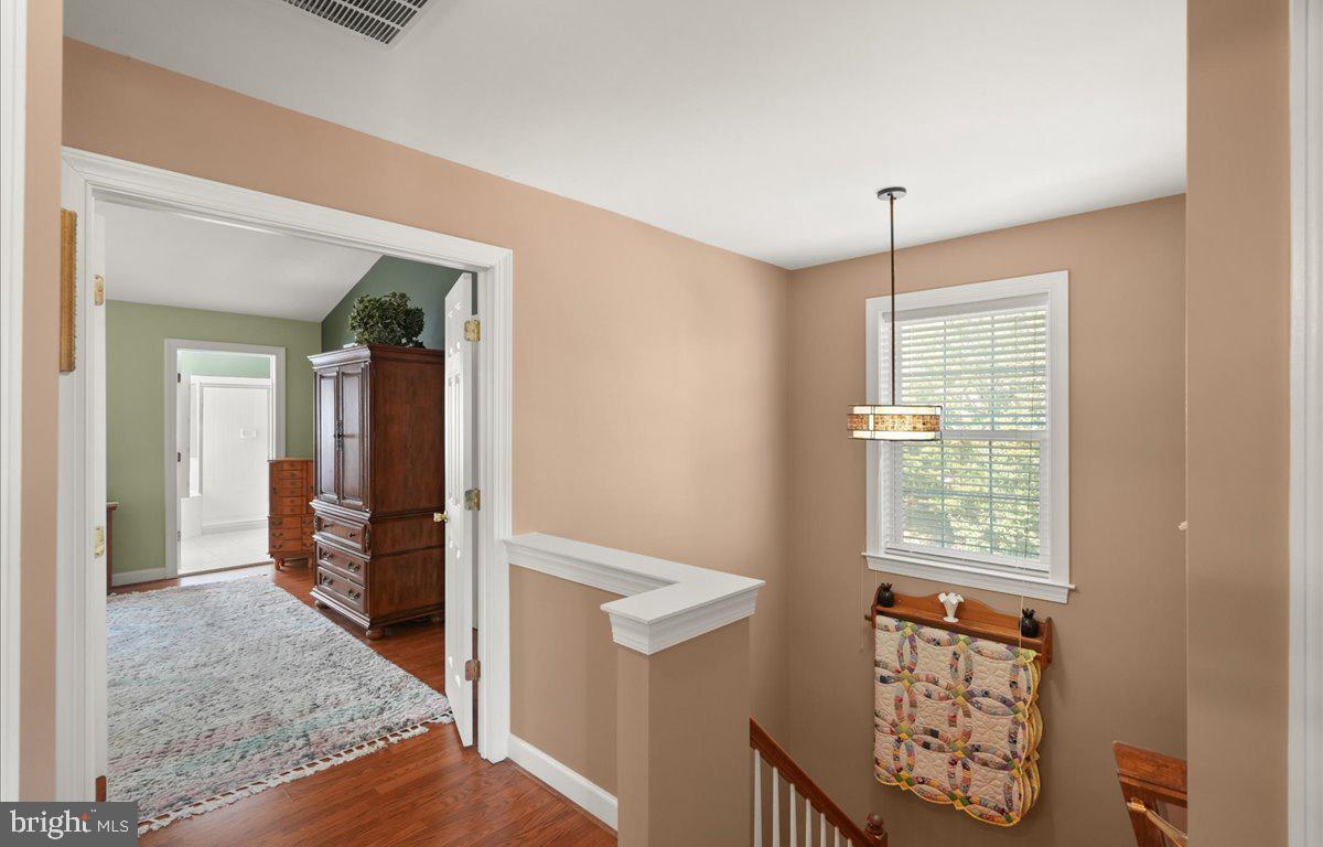 9199 Furey Road Lorton, VA 22079 - Photo 20 of 44 wooden floor in an empty room with a window