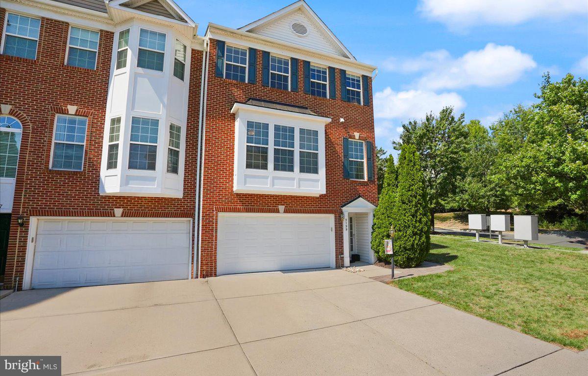 9199 Furey Road Lorton, VA 22079 - Photo 2 of 44 a front view of a house with garden