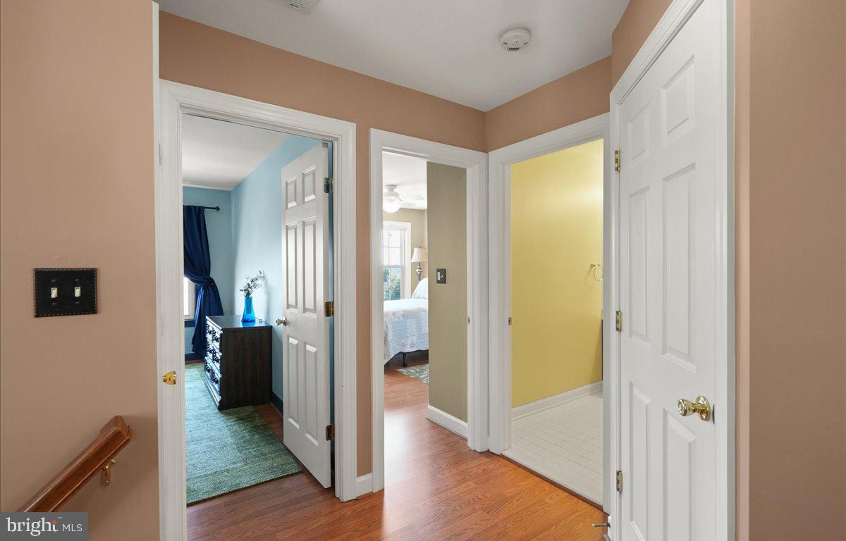 9199 Furey Road Lorton, VA 22079 - Photo 21 of 44 a view of a hallway with wooden floor and living room
