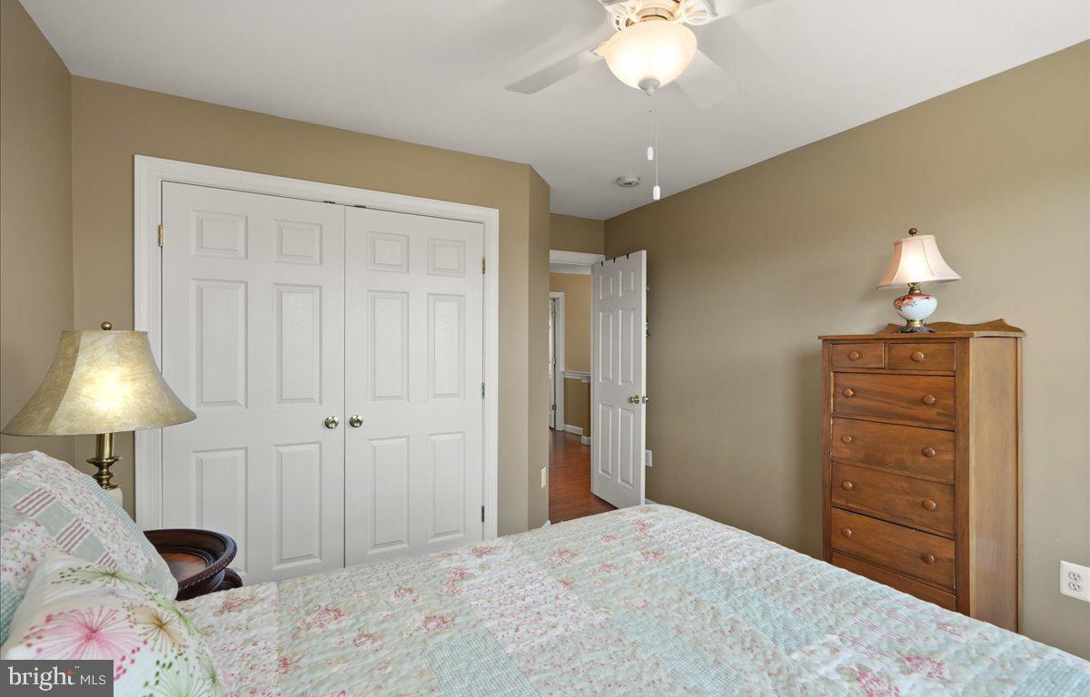 9199 Furey Road Lorton, VA 22079 - Photo 31 of 44 a bedroom with a bed and a lamp