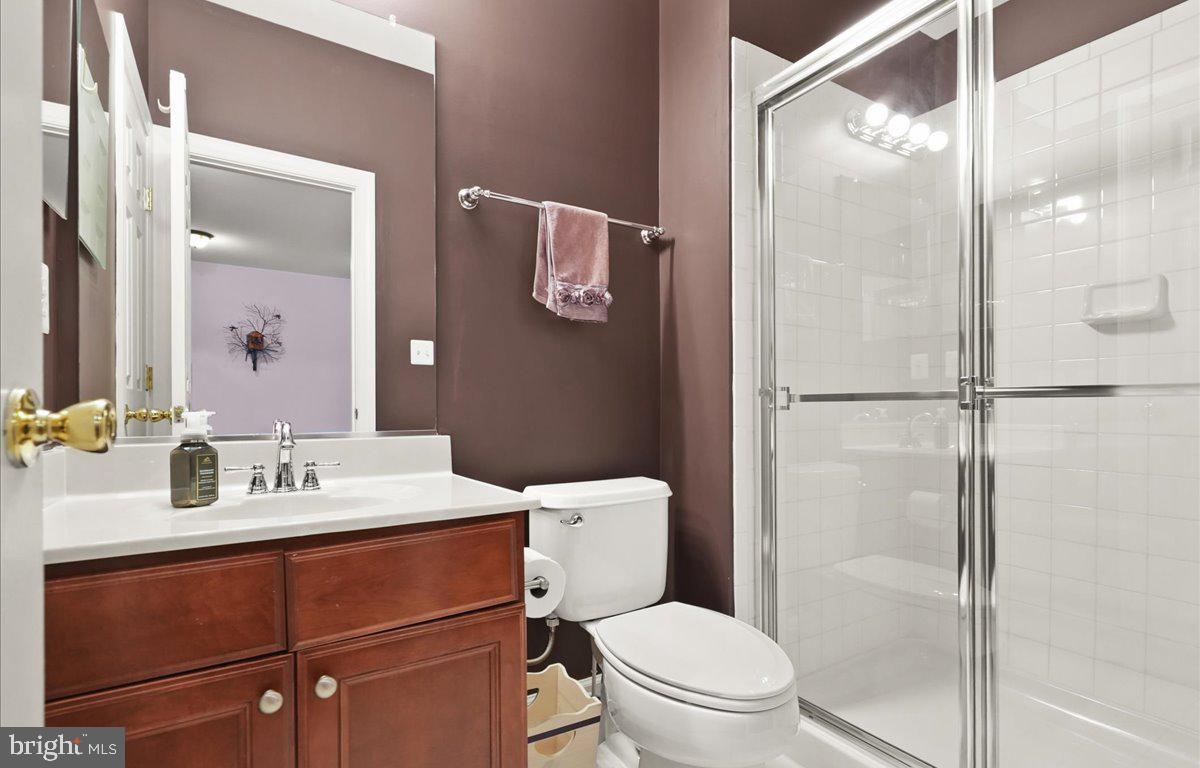 9199 Furey Road Lorton, VA 22079 - Photo 36 of 44 a bathroom with a sink vanity mirror and toilet