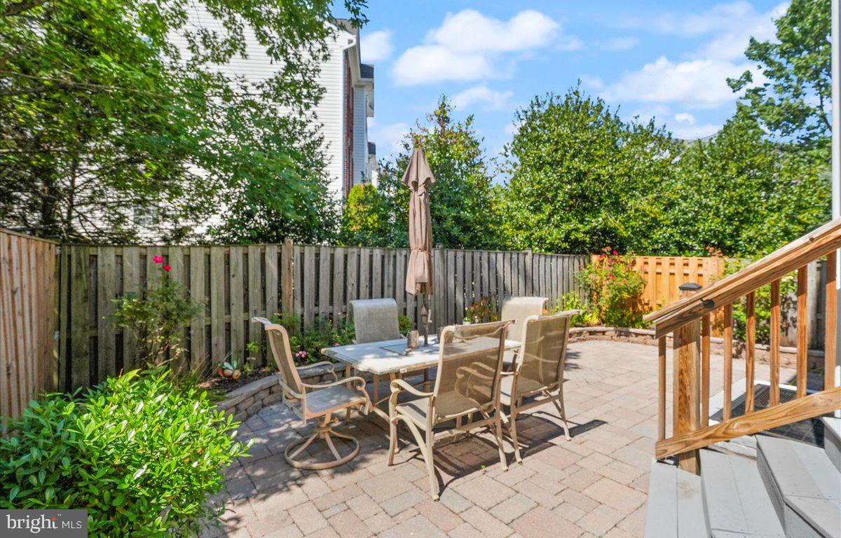 9199 Furey Road Lorton, VA 22079 - Photo 37 of 44 a view of a patio with a table and chairs