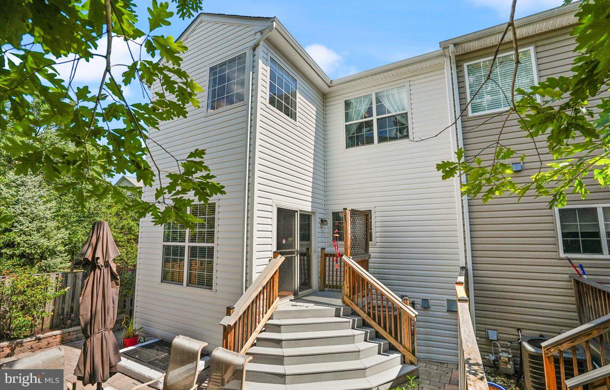 9199 Furey Road Lorton, VA 22079 - Photo 39 of 44 a view of deck with chairs and potted plants