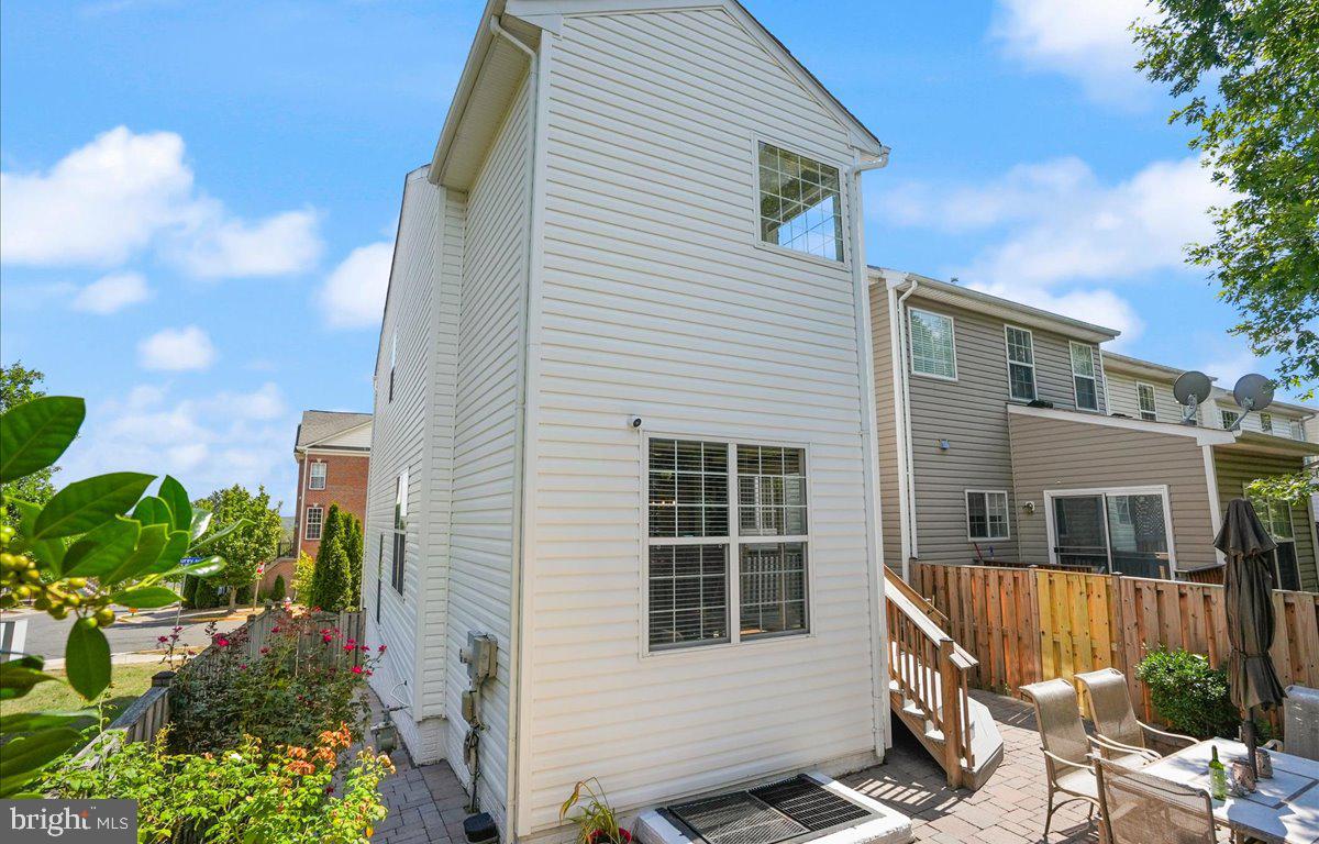 9199 Furey Road Lorton, VA 22079 - Photo 44 of 44 a view of a house with a yard and sitting area