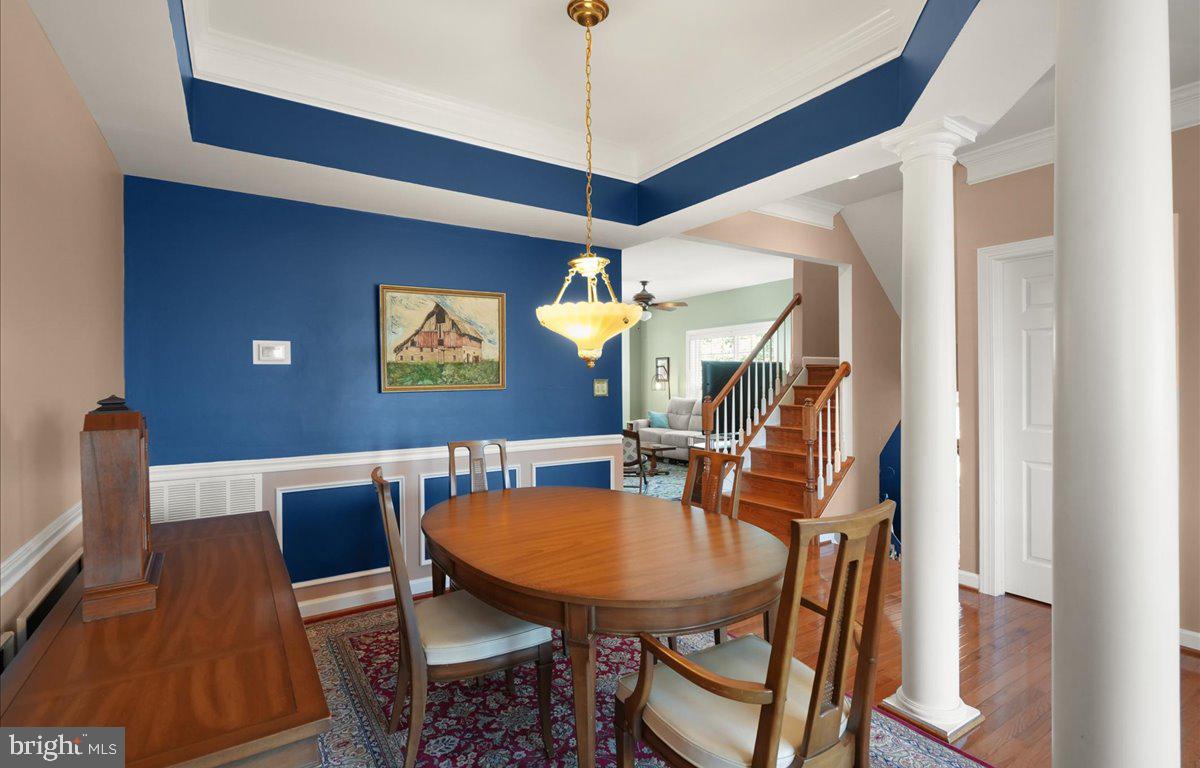 9199 Furey Road Lorton, VA 22079 - Photo 8 of 44 a view of a dining room with furniture and wooden floor