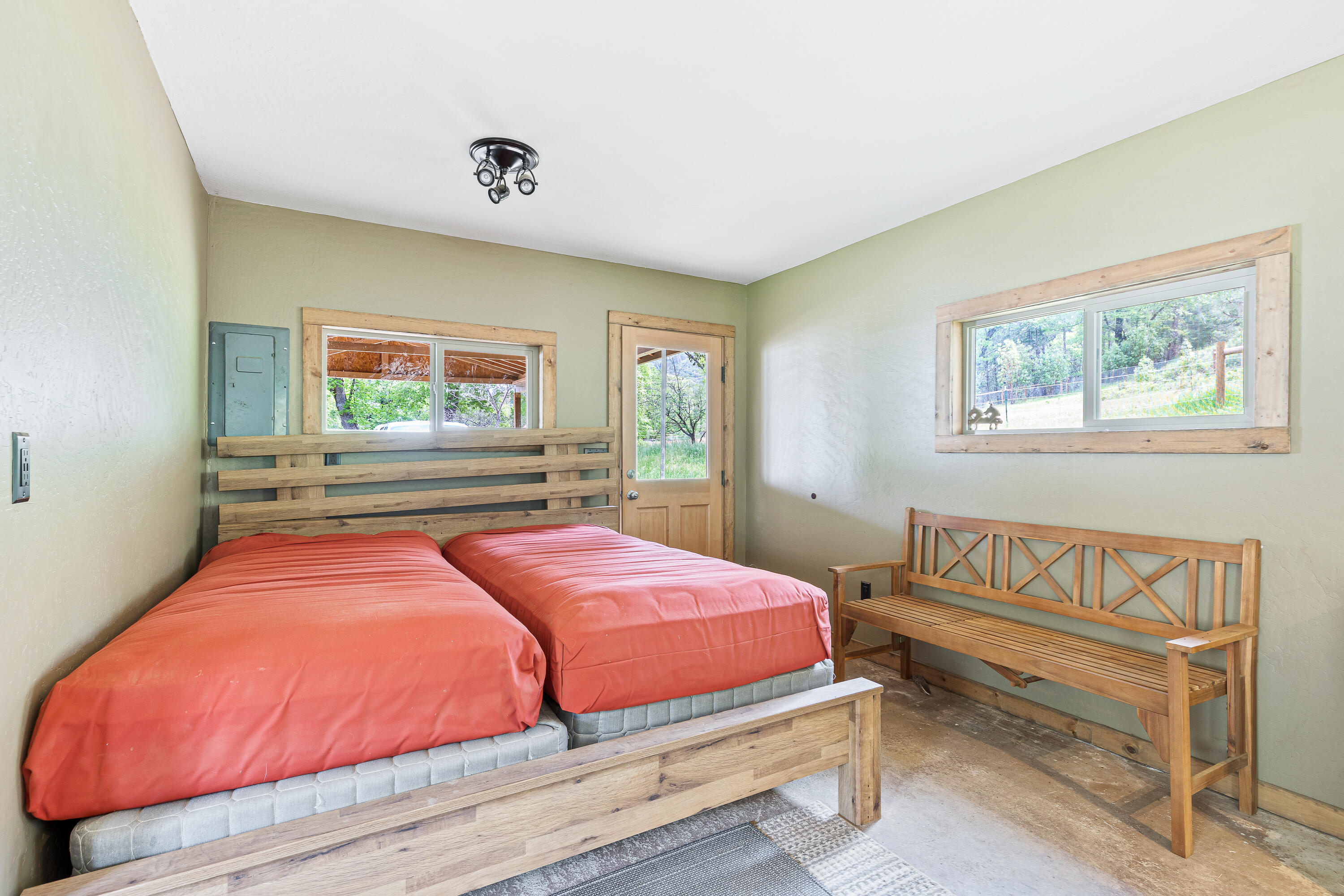13721 Upper Applegate Road Jacksonville, OR 97530 - Photo 15 of 26 a bedroom with a bed and window