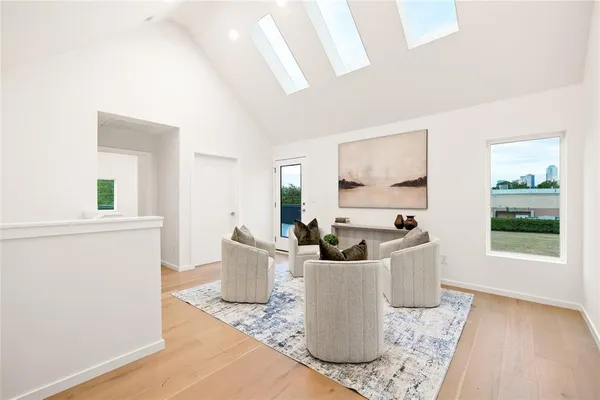 a living room with furniture a window and a table