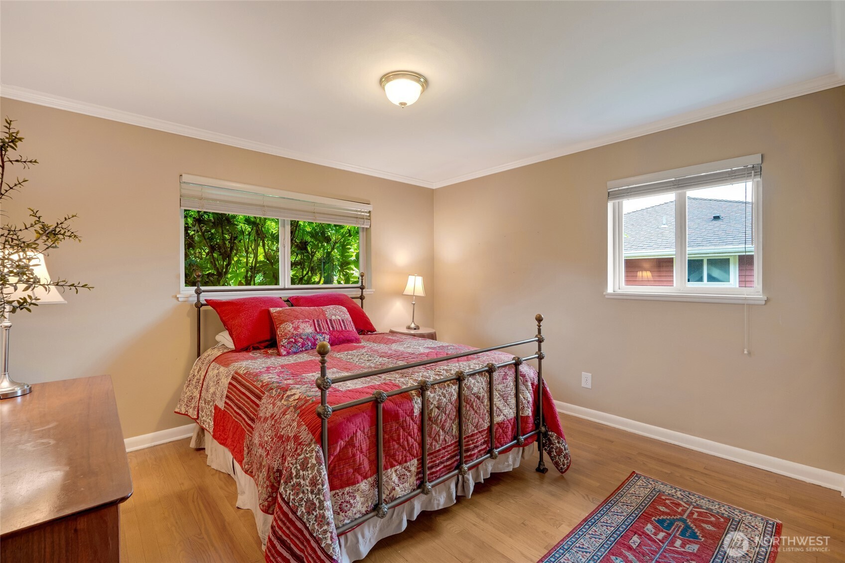 811 Rucker Avenue Everett, WA 98201 - Photo 14 of 34 a bed sitting in a bedroom next to a window