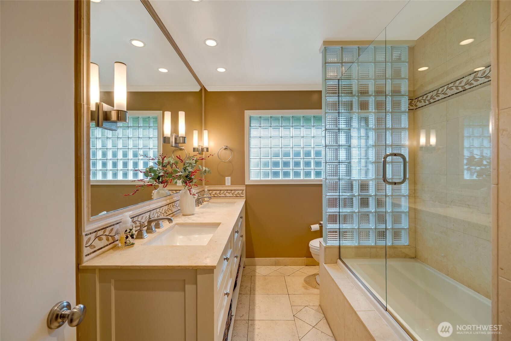 811 Rucker Avenue Everett, WA 98201 - Photo 15 of 34 a bathroom with a tub a sink and a shower