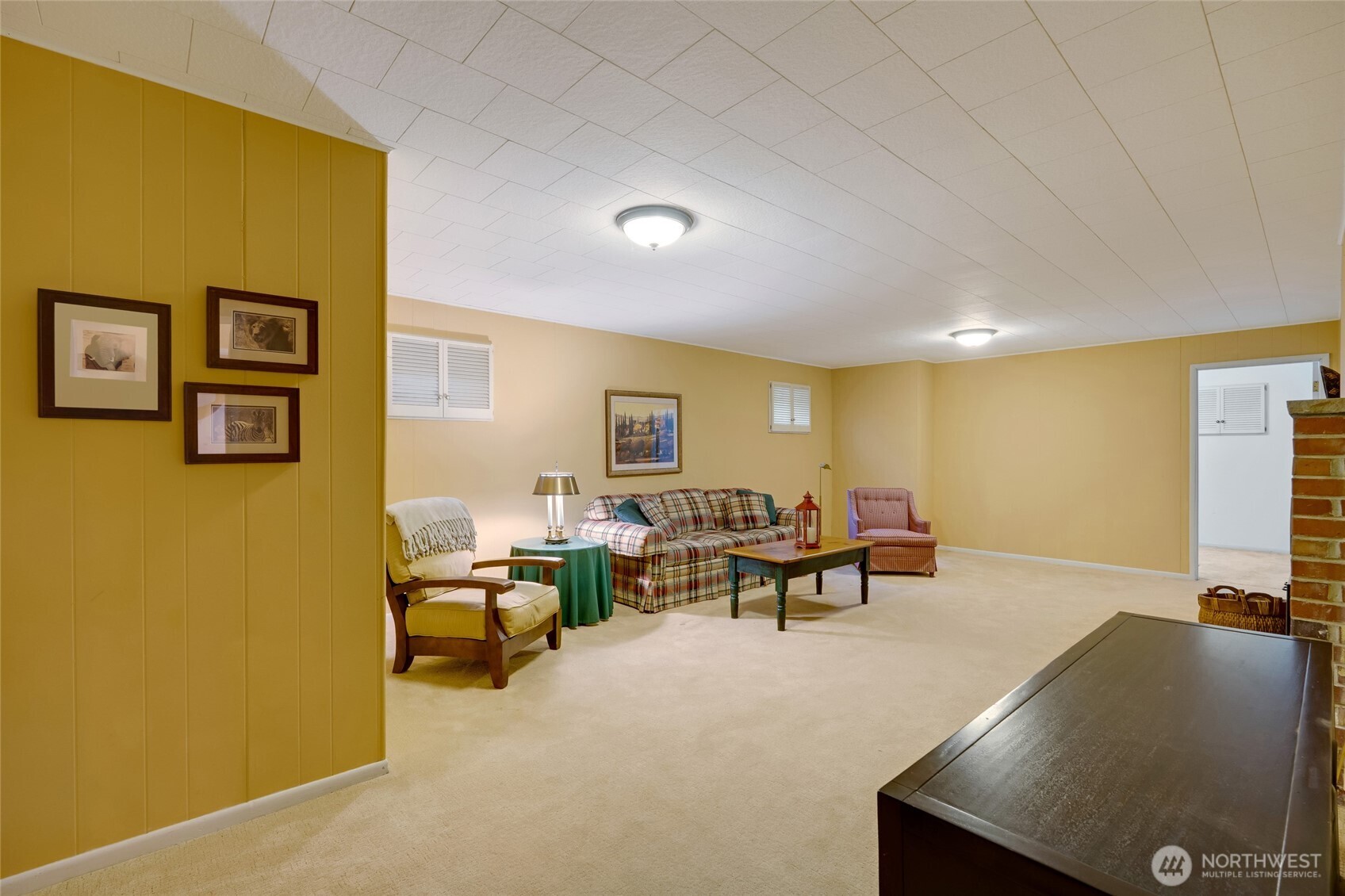 811 Rucker Avenue Everett, WA 98201 - Photo 18 of 34 a living room with furniture and a flat screen tv
