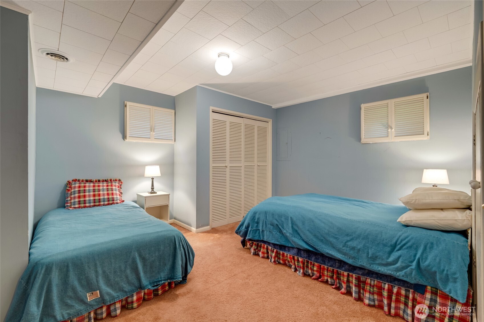 811 Rucker Avenue Everett, WA 98201 - Photo 21 of 34 a bedroom with two beds and a lamp