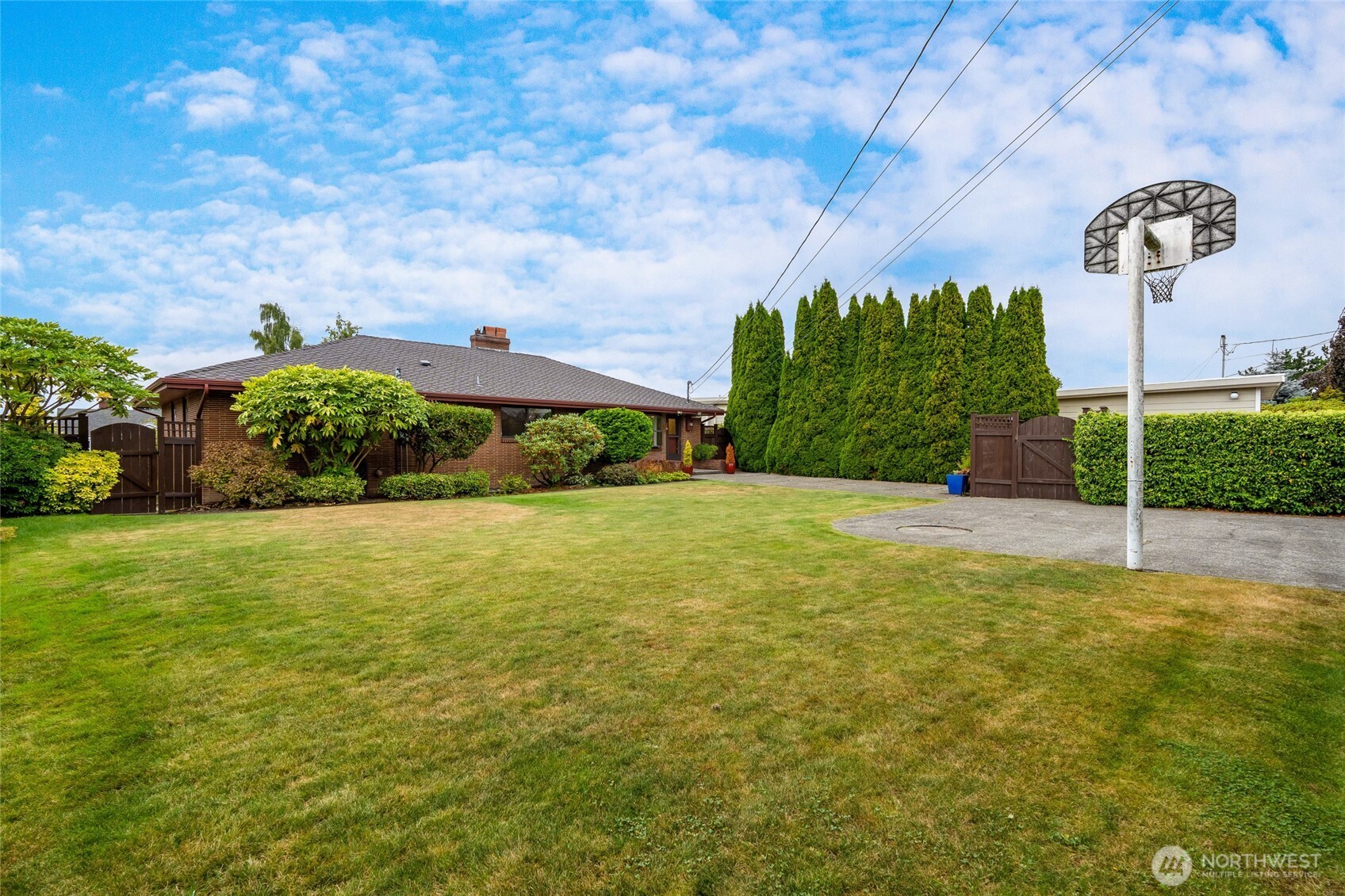 811 Rucker Avenue Everett, WA 98201 - Photo 29 of 34 a view of a big yard with potted plants