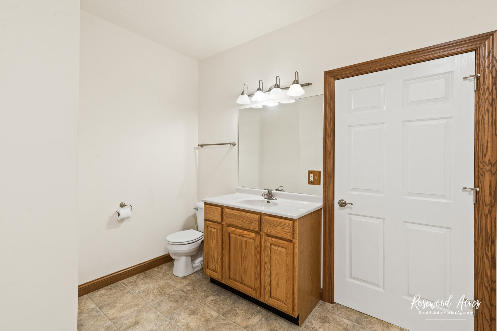 187 East Water Street Kankakee, IL 60901 - Photo 10 of 24 a bathroom with a toilet a sink and mirror