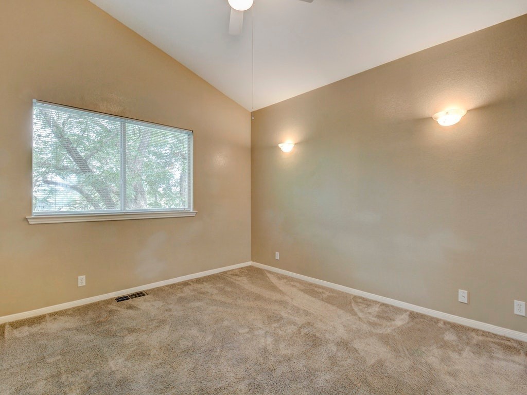 2502 Leon Street, Unit 102 Austin, TX 78705 - Photo 10 of 14 an empty room with a window