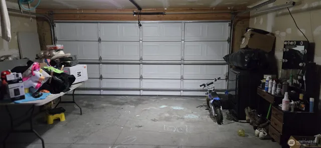 a kitchen with stainless steel appliances granite countertop a refrigerator sink and microwave