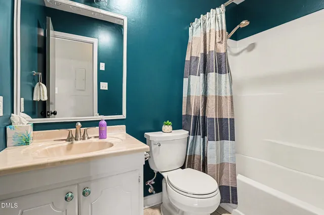 a front view of a house with a yard table and chairs