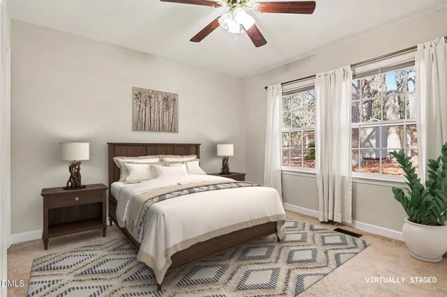 a bedroom with a large bed and a window