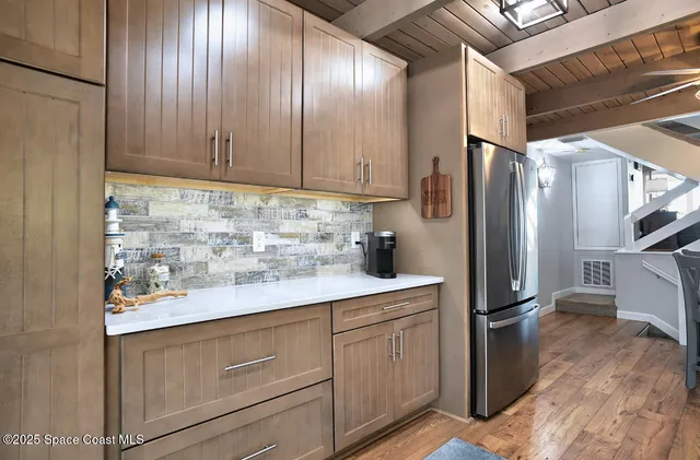a kitchen with appliances cabinets and a counter top space