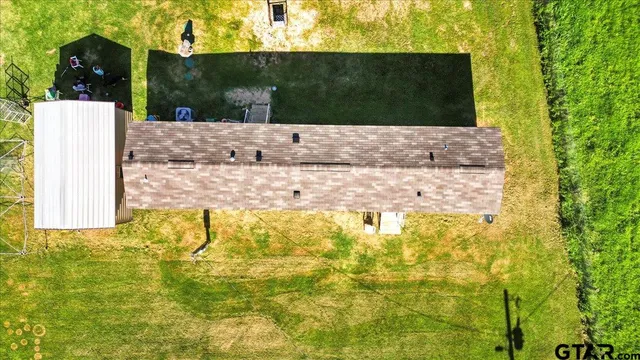 a view of a lake with a yard