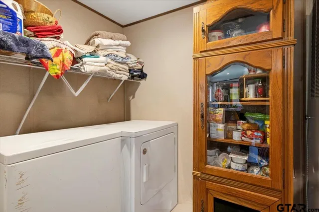 a bedroom with two beds and a chair